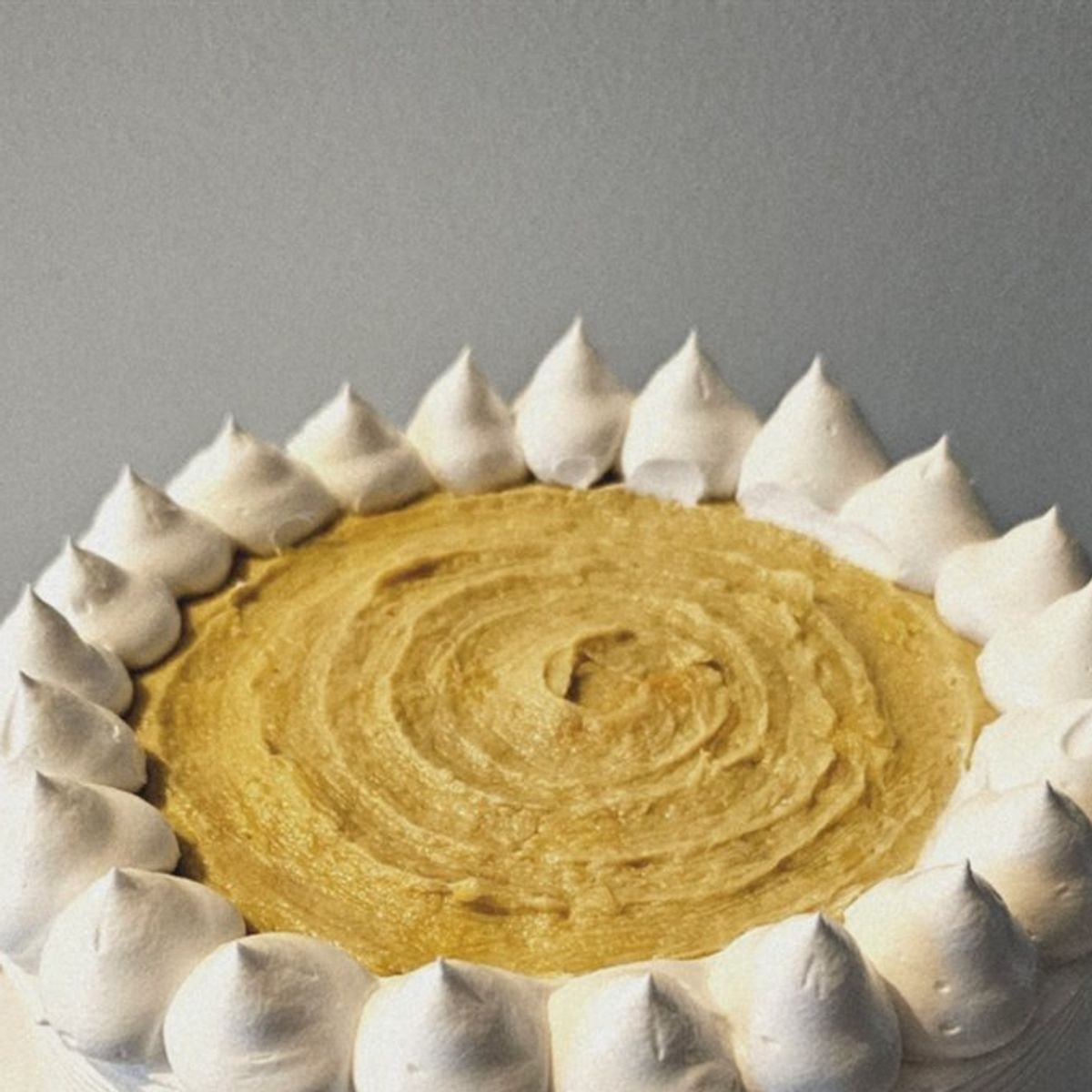 Durian cake topped with piped durian paste by Amour Desserts